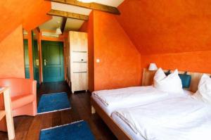 Postel nebo postele na pokoji v ubytování Hotel Garni Winzerhof Hödl