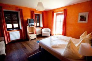 Postel nebo postele na pokoji v ubytování Hotel Garni Winzerhof Hödl