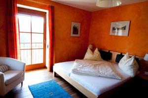 Postel nebo postele na pokoji v ubytování Hotel Garni Winzerhof Hödl