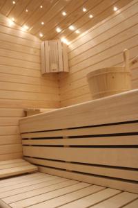 a sauna with a fan and a bucket in it at Appartamento Suite centro Livigno 4S - Sabrina in Livigno +20 photos