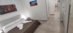 Postel nebo postele na pokoji v ubytování InBlu + 37 fotografií
