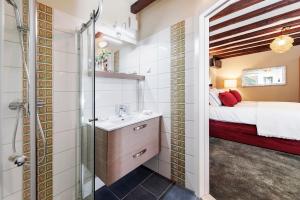 a bathroom with a sink and a bed in a room at Luxury Villa Orh Rovinj in Rovinj +114 photos