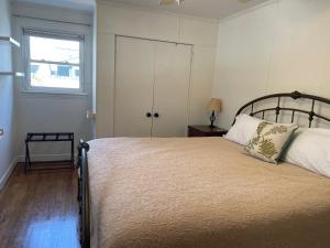 a bedroom with a large bed and a window at The Hideaway in Downtown Brevard in Brevard
