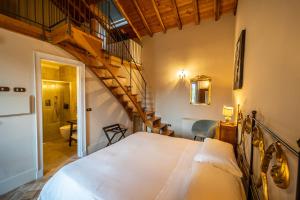 מיטה או מיטות בחדר ב-Casa Arrigo