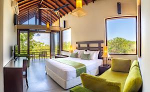 a bedroom with a bed and a living room at Rock Wild Yala in Yala +22 photos