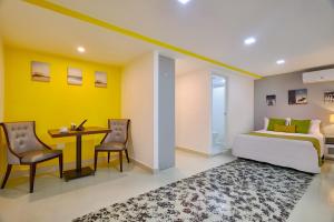 Katil atau katil-katil dalam bilik di Malecon Premium Rooms & Hotel