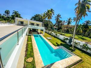 an aerial view of a house with a swimming pool at Villa Calma, luxury for big groups at the beach with large pool in Las Terrenas