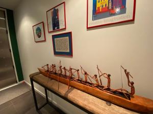 a wooden boat on display in a museum at Refreshstay in Palmerston North