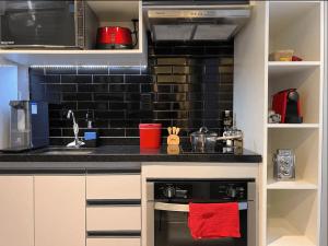 Una cocina o zona de cocina en Studios Sampa - Parque Augusta