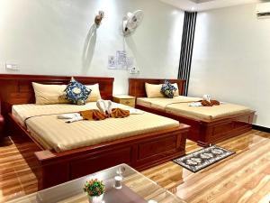 Giường trong phòng chung tại Chomkatae Bungalows