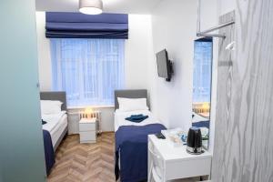 Postel nebo postele na pokoji v ubytování HOT SPOT Vilnius Apartments!
