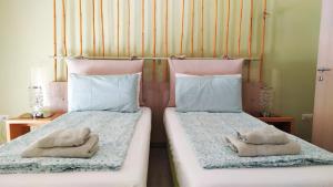 Tempat tidur dalam kamar di B&B Caorle For You