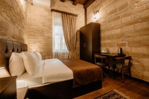 Кровать или кровати в номере Sazeli Boutique Hotel