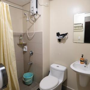 a bathroom with a shower and a toilet and a sink at Avida Davao Condos, downtown CM Recto Avenue, Davao City in Davao City +105 photos