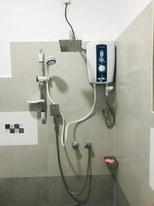 a shower in a bathroom with a shower at Hotel Ganthera Kataragama in Kataragama