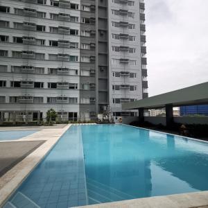 an empty swimming pool in front of a building at Avida Davao Condos, downtown CM Recto Avenue, Davao City in Davao City