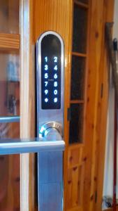 a close up of a remote control on a door at Chalet del paese Incantato in Moncenisio
