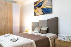 Łóżko lub łóżka w pokoju w obiekcie Diana Holiday Home