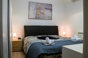Łóżko lub łóżka w pokoju w obiekcie Diana Holiday Home