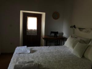 A bed or beds in a room at Villa Katia with Sea view, Pourion, Zagora