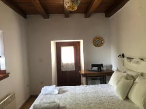 A bed or beds in a room at Villa Katia with Sea view, Pourion, Zagora