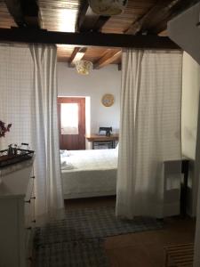 A bed or beds in a room at Villa Katia with Sea view, Pourion, Zagora