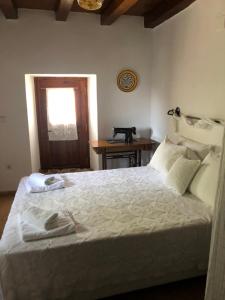 A bed or beds in a room at Villa Katia with Sea view, Pourion, Zagora