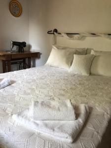 A bed or beds in a room at Villa Katia with Sea view, Pourion, Zagora
