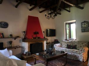 A television and/or entertainment centre at Villa Katia with Sea view, Pourion, Zagora