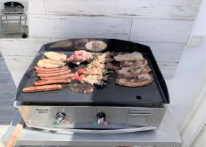 a grill with a bunch of different types of meat at Maison typique vendéenne in La Tranche-sur-Mer +3 photos