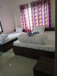 Giường trong phòng chung tại Hotel Kanthak