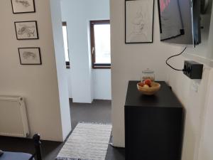 a room with a table with a bowl of fruit on it at Kleines aber feines Apartment in Gelsenkirchen