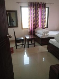 Giường trong phòng chung tại Hotel Kanthak