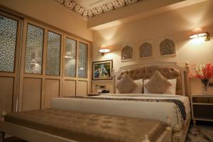 Laxmi Palace Heritage Boutique Hotel客房内的一张或多张床位