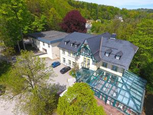 an aerial view of a large house with a large window at Parkhotel Waldschlösschen in Annaberg-Buchholz