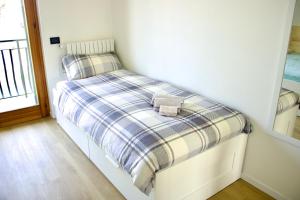 A bed or beds in a room at Appartamento Katia