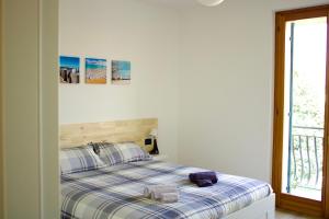 A bed or beds in a room at Appartamento Katia