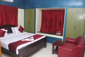 Krevet ili kreveti u jedinici u objektu Skyry Hotels T Nagar