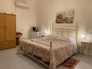 a bedroom with a large bed in a room at B&B Paradiso San Vincenzo in Molfetta
