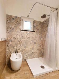 a bathroom with a sink and a toilet and a shower at La Terrazza Sul Blu in Corniglia