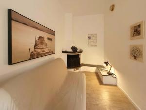 a living room with a large tv on the wall at La Terrazza Sul Blu in Corniglia
