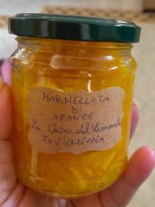 a jar of honey with a label on it at La Casa del Limoneto in Favignana