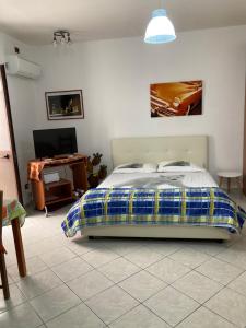 The Ronco Apartment tesisinde bir odada yatak veya yataklar