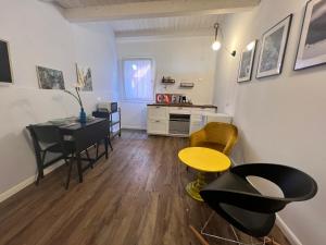 a room with a table and chairs and a dining room at CIVICO475 House Chioggia in Chioggia