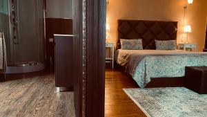 
a bedroom with a bed and a dresser at Quinta da Casa Cimeira, Guest House, Wines & Food in Valença do Douro
