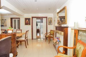 a living room with a table and a dining room at pedro host family in London