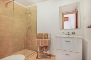 a bathroom with a shower and a toilet and a sink at Duquesa Harbour Club Aparthotel in Manilva +37 photos