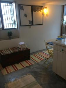 a living room with a couch and a table at Traditional House Ekaterini Alonissos in Alonnisos +20 photos