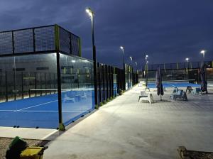 a tennis court in front of a building at Hotel Select in Atessa