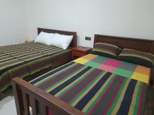 Katil atau katil-katil dalam bilik di Sigiri Jungle Villa